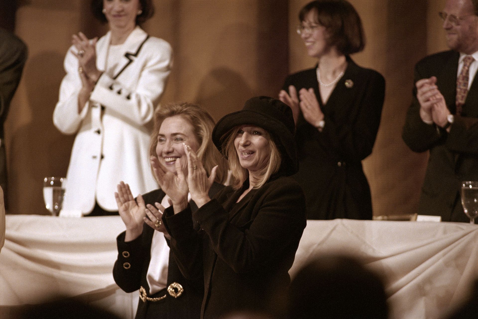 Hillary Rodham Clinton and Barbra Streisand Clapping - Source: Getty