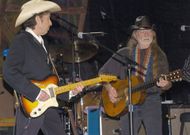 Willie Nelson and Bob Dylan on stage durig Outlaws and Angels Tour. Willie Nelson and Friends. Image via Getty.