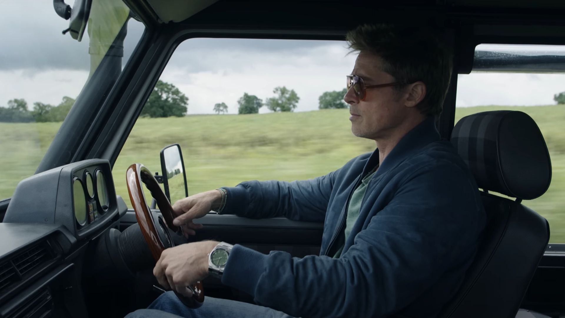 Brad Pitt driving a car