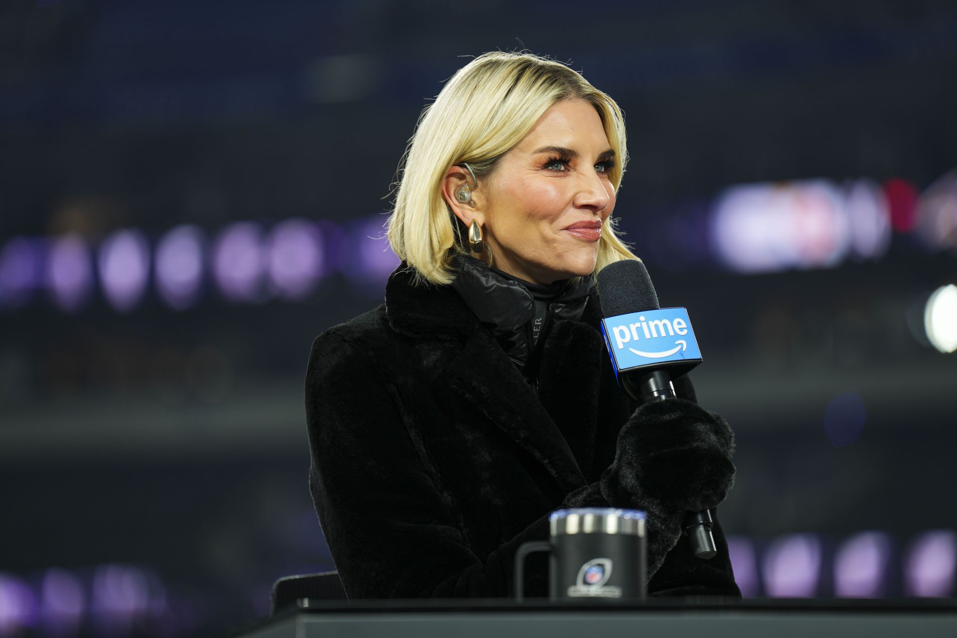 Charissa Thompson reporting during a game (Image via Getty)