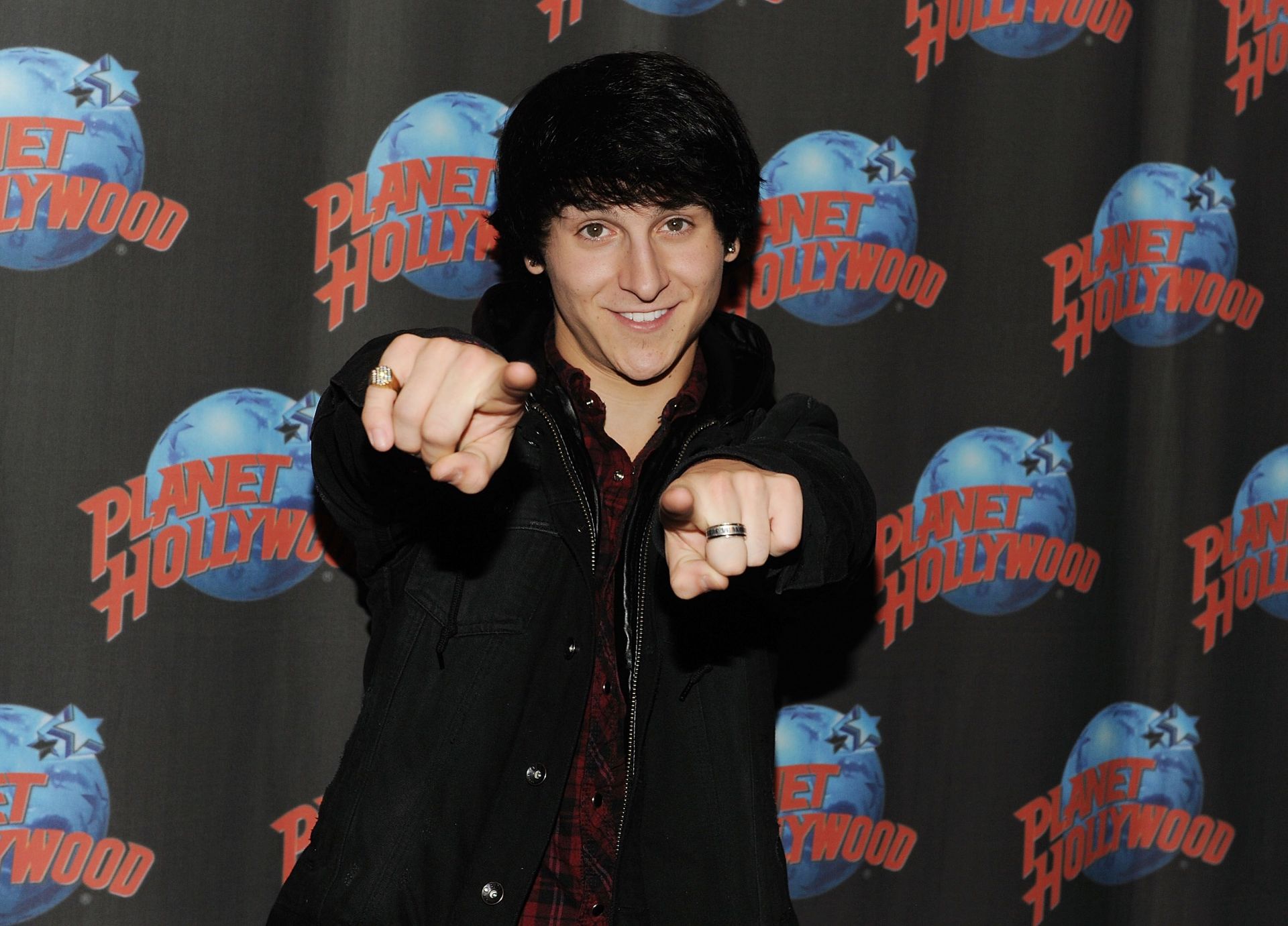 Mitchel Musso Visits Planet Hollywood Times Square - Source: Getty