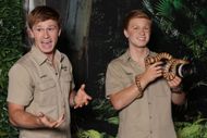 Robert Irwin posing with his wax figure (Image via Getty)