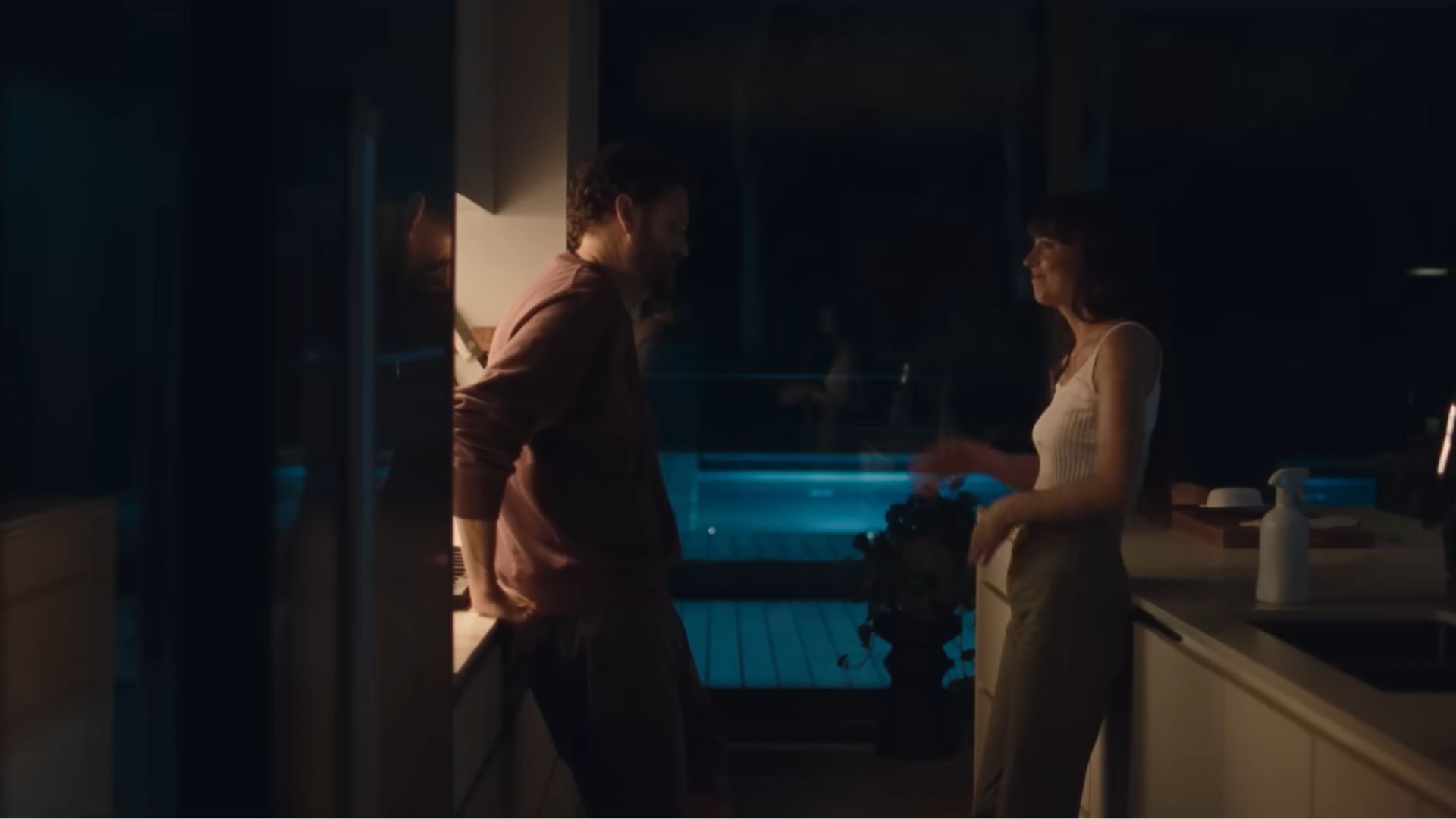 Two friends standing in a kitchen