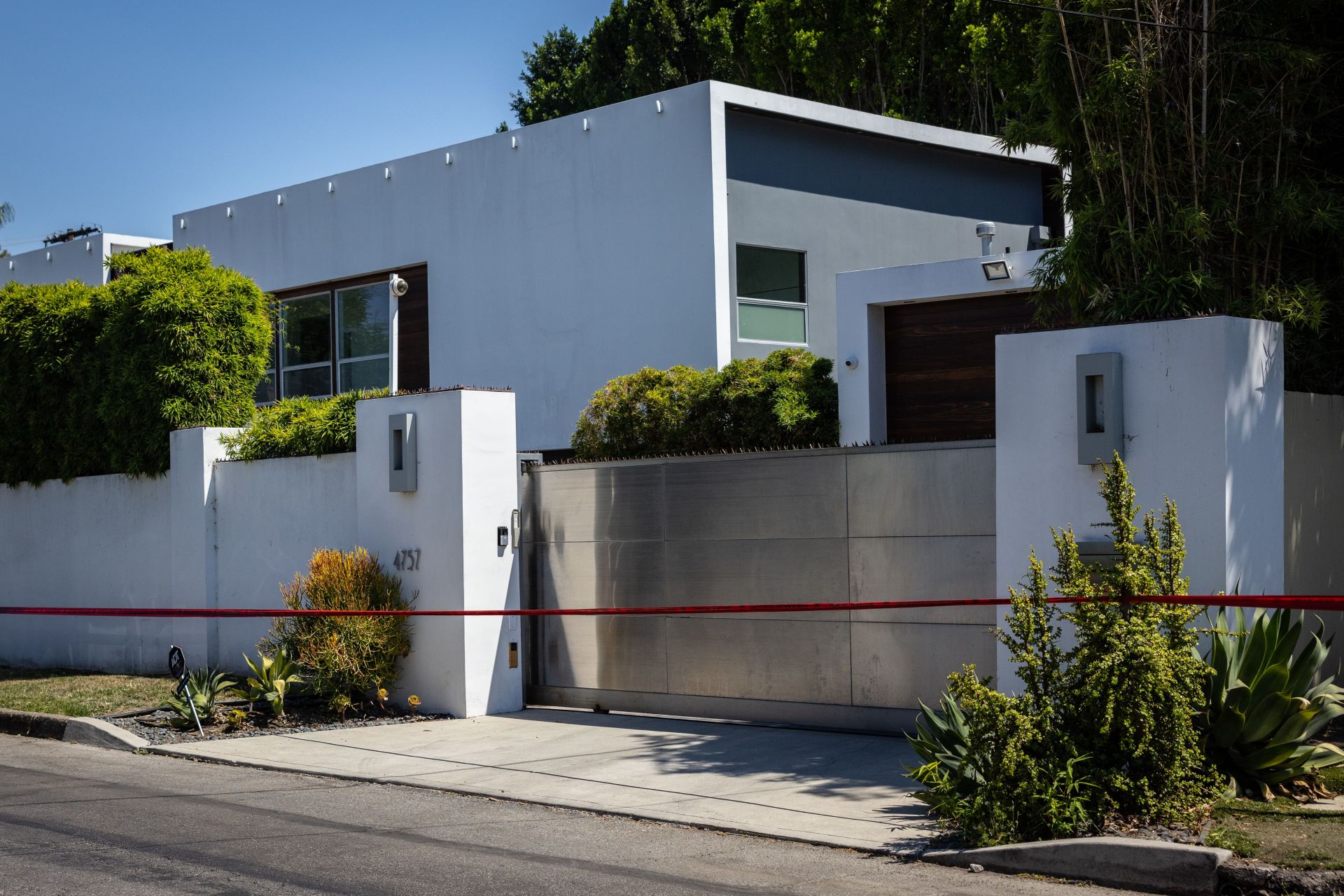 Los Angeles Police Department officials secure the home where Robin Kaye an &quot;American Idol&quot; music supervisor and her husband Thomas Deluca were found killed with gunshot wounds to the head... - Source: Getty