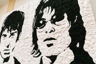 Oasis "Wonder Wall" Bucket Hat Portrait Unveiled In Cardiff (Image via Getty)