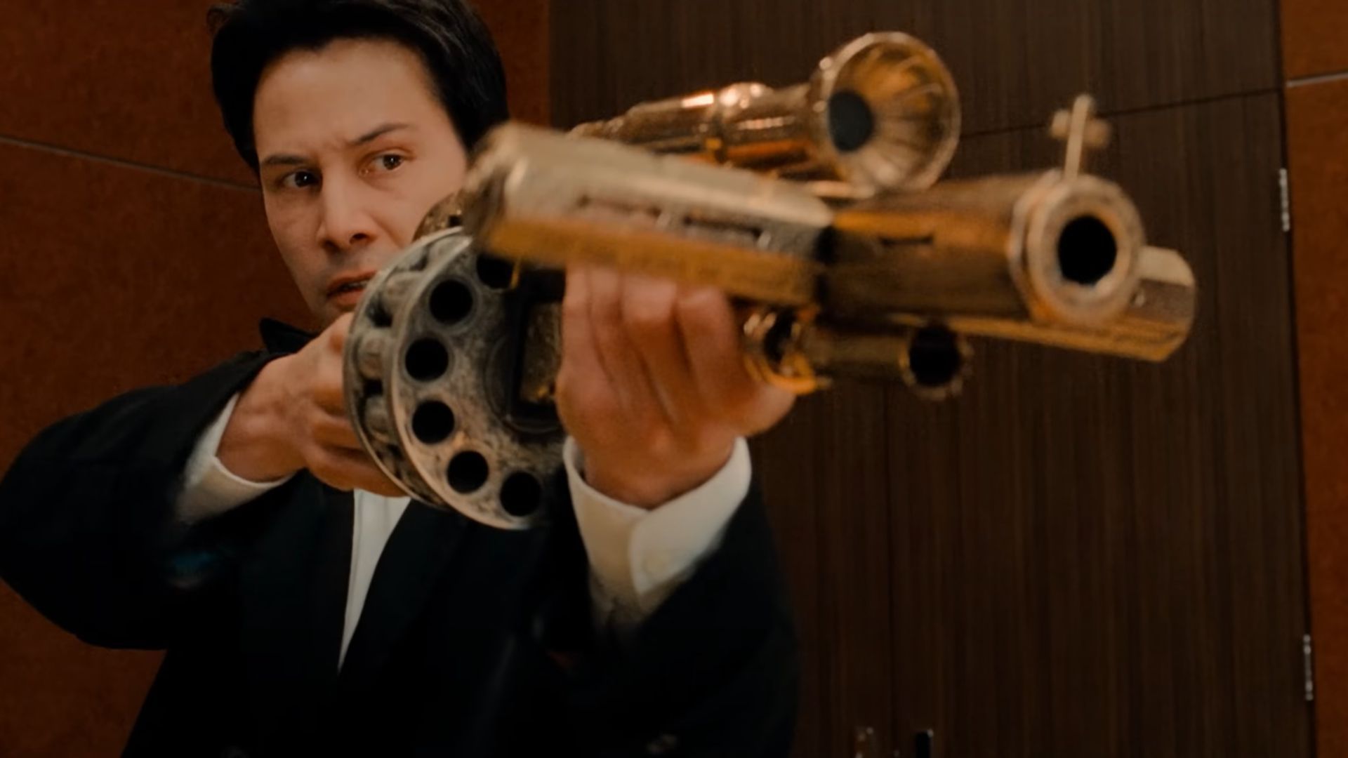 Constantine about to fire a shotgun