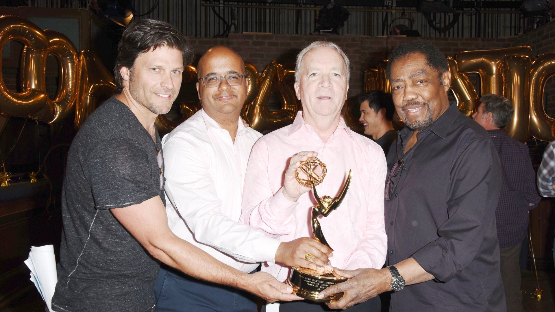 Greg Vaughan (Eric), then-NBCUniversal exec Bruce Evans, Ken Corday, executive producer, and James Reynolds (Abe) celebrate Days of our Lives Daytime Emmy wins in 2018 | Image: JPI