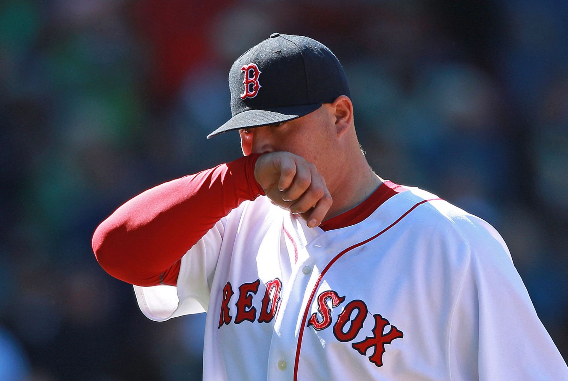 Boston, MA  &permil;    Boston Red Sox relief pitcher Bobby Jenks reacts as he hears the boo birds sing upon his exit from the game in the 6th inning, nearly tarnishing Tim Wakefield
