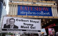 Anti-Trump protesters rally outside CBS Late Show Studio over Colbert Firing - Source: Getty