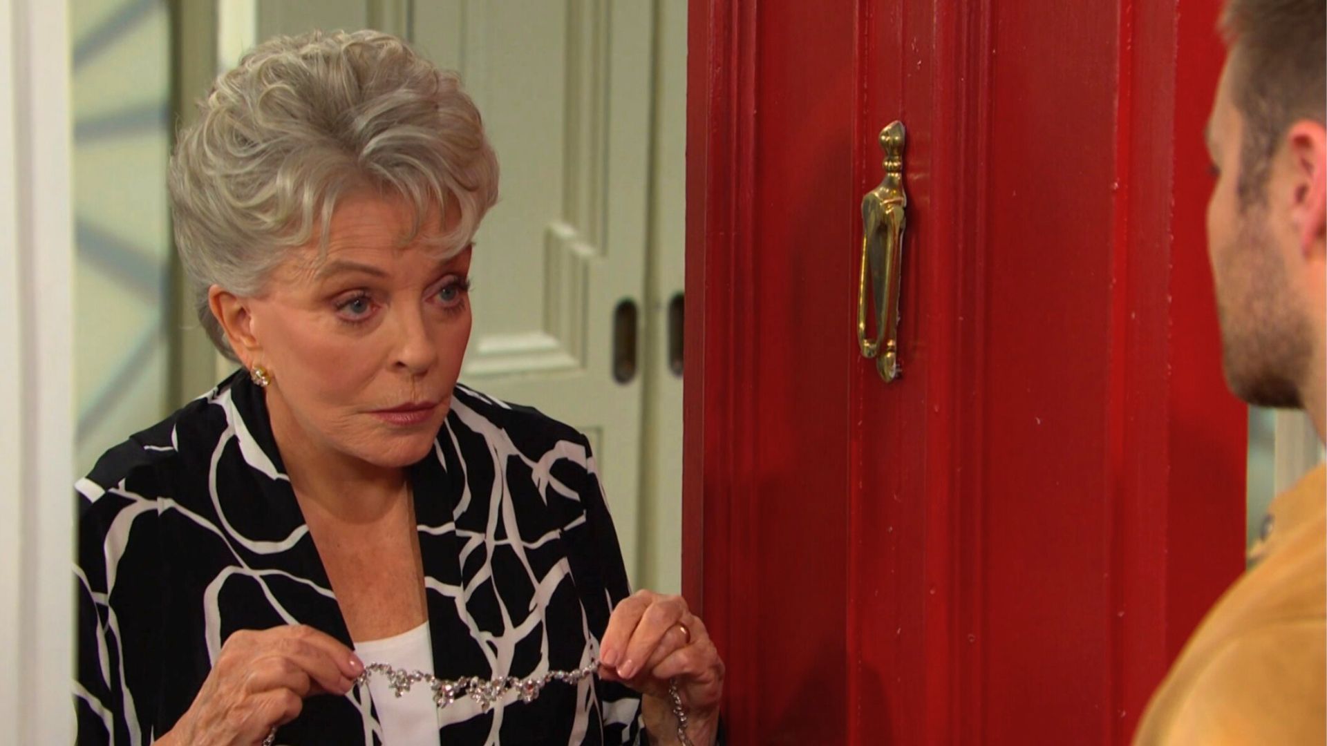 Doug hands Alice&#039;s necklace to Julie on Days of our Lives | Image: JPI
