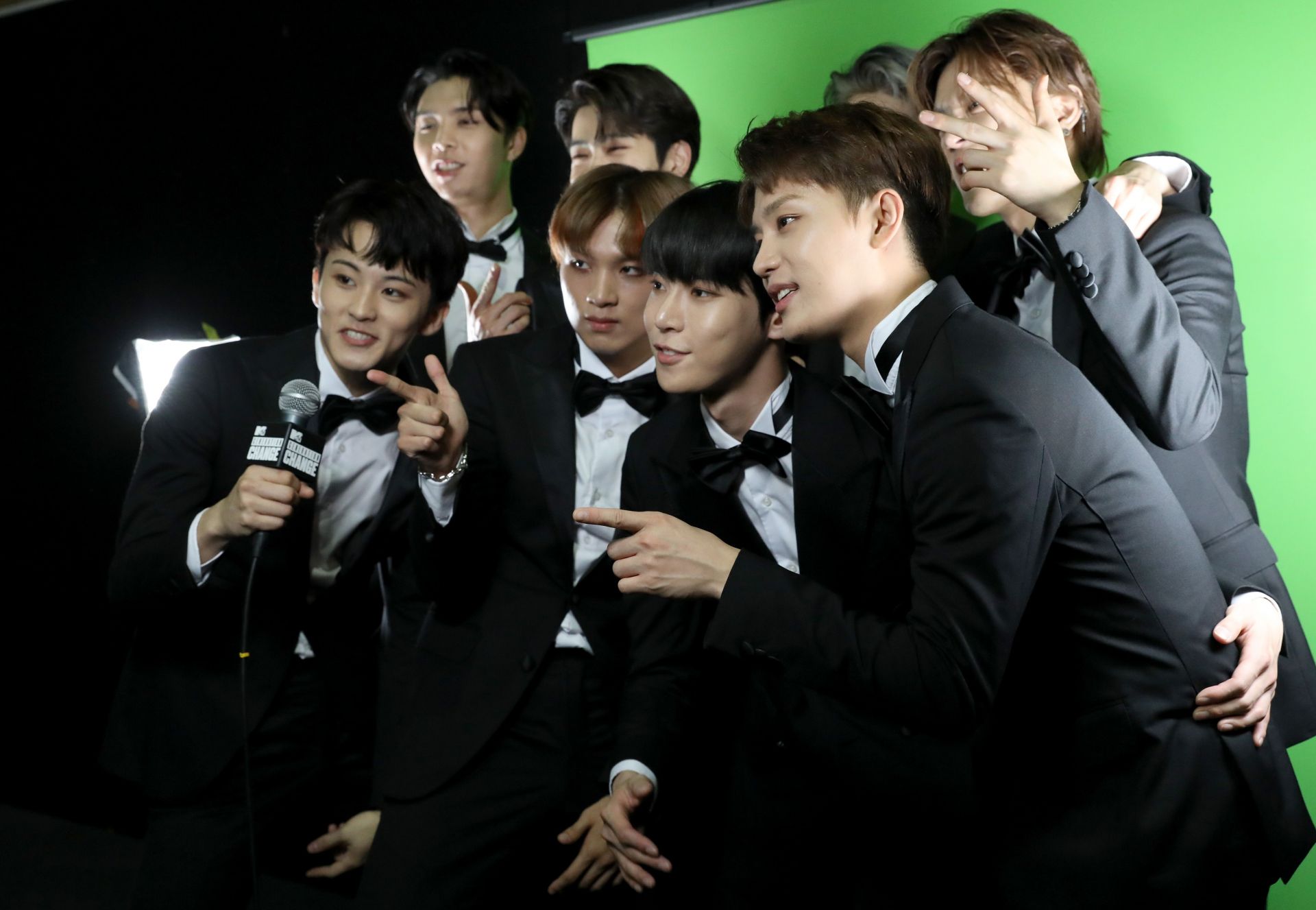 (L-R) Johnny, Haechan, Mark, Jaehyun, Taeyong, Yuta, Taeil, and Doyoung of NCT 127 backstage (Source: Getty)