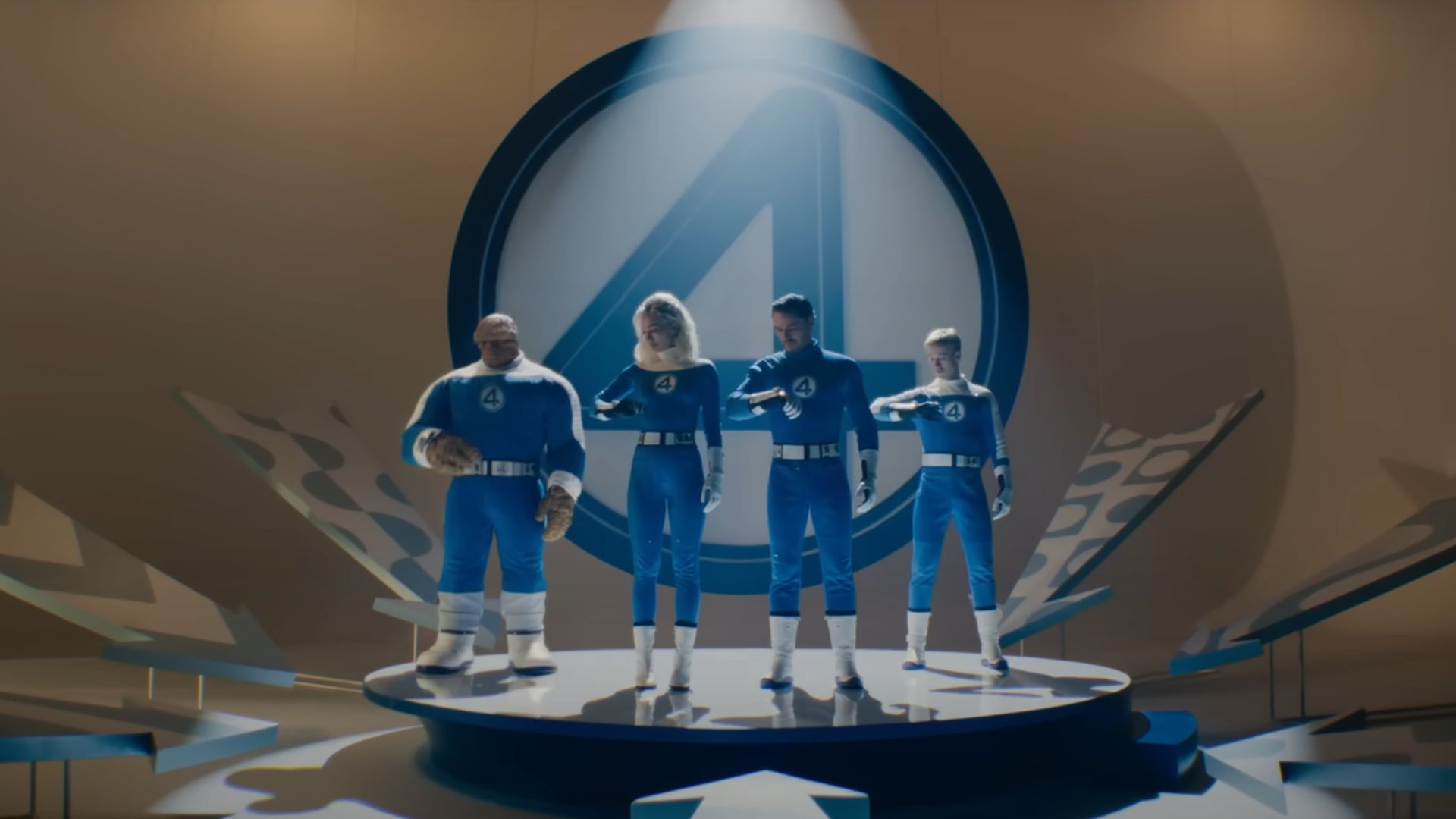 Fantastic Four standing on a stage, watching their watches
