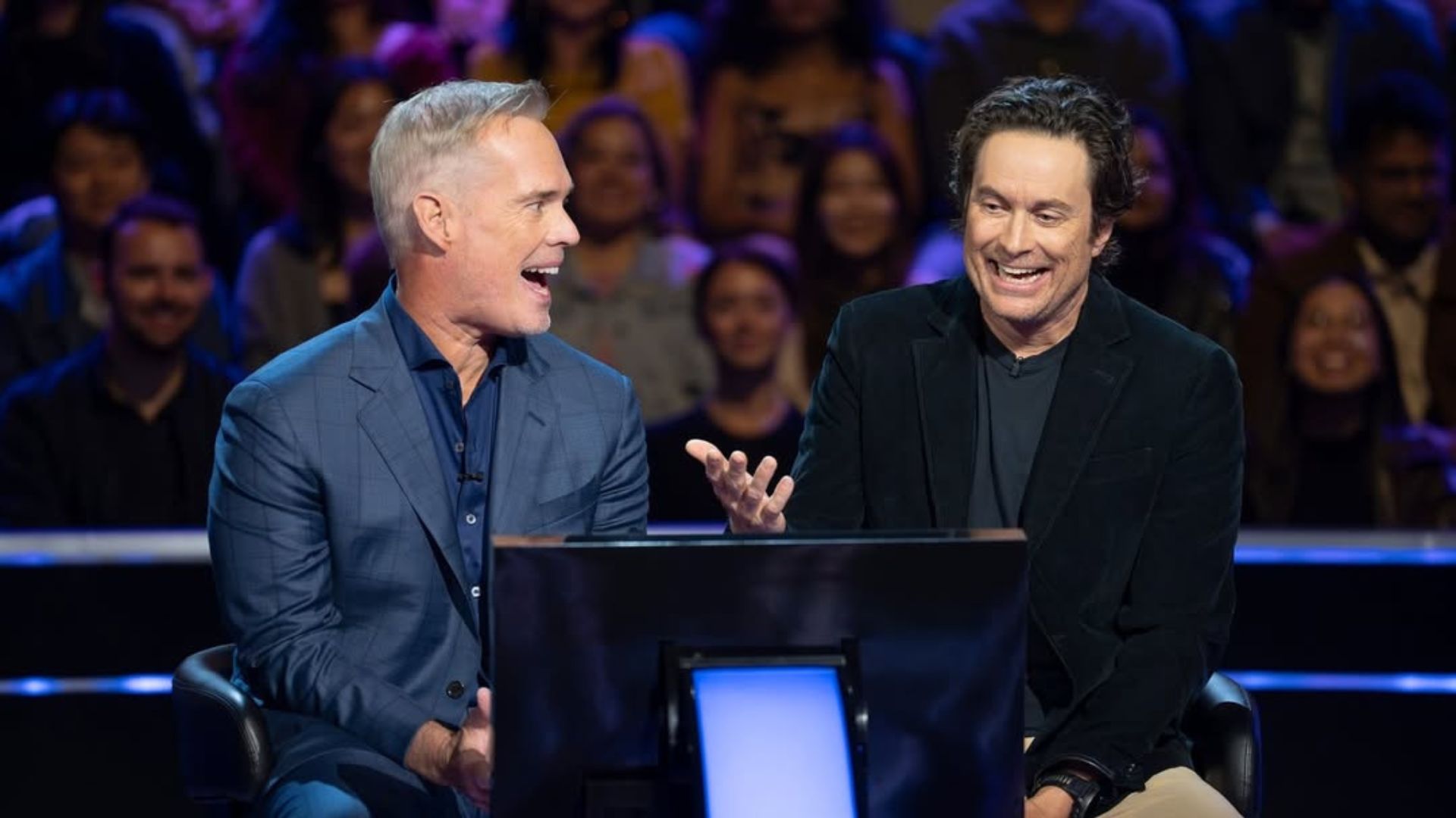Joe Buck and Oliver Hudson from Who Wants to Be a Millionaire | Image via Instagram/ @millionairetv