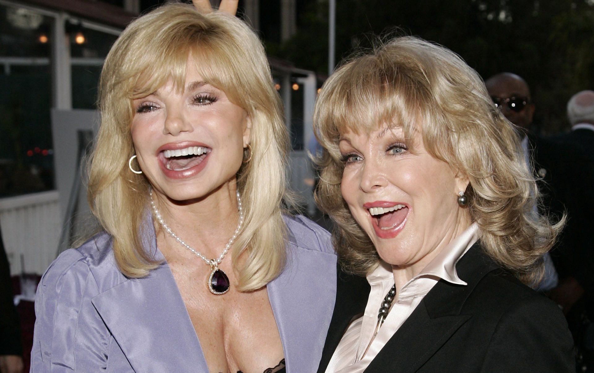 Loni Anderson and Barbara Eden attend a tribute event honoring Red Buttons in Los Angeles on August 7, 2006. (Image via Getty/Vince Bucci)