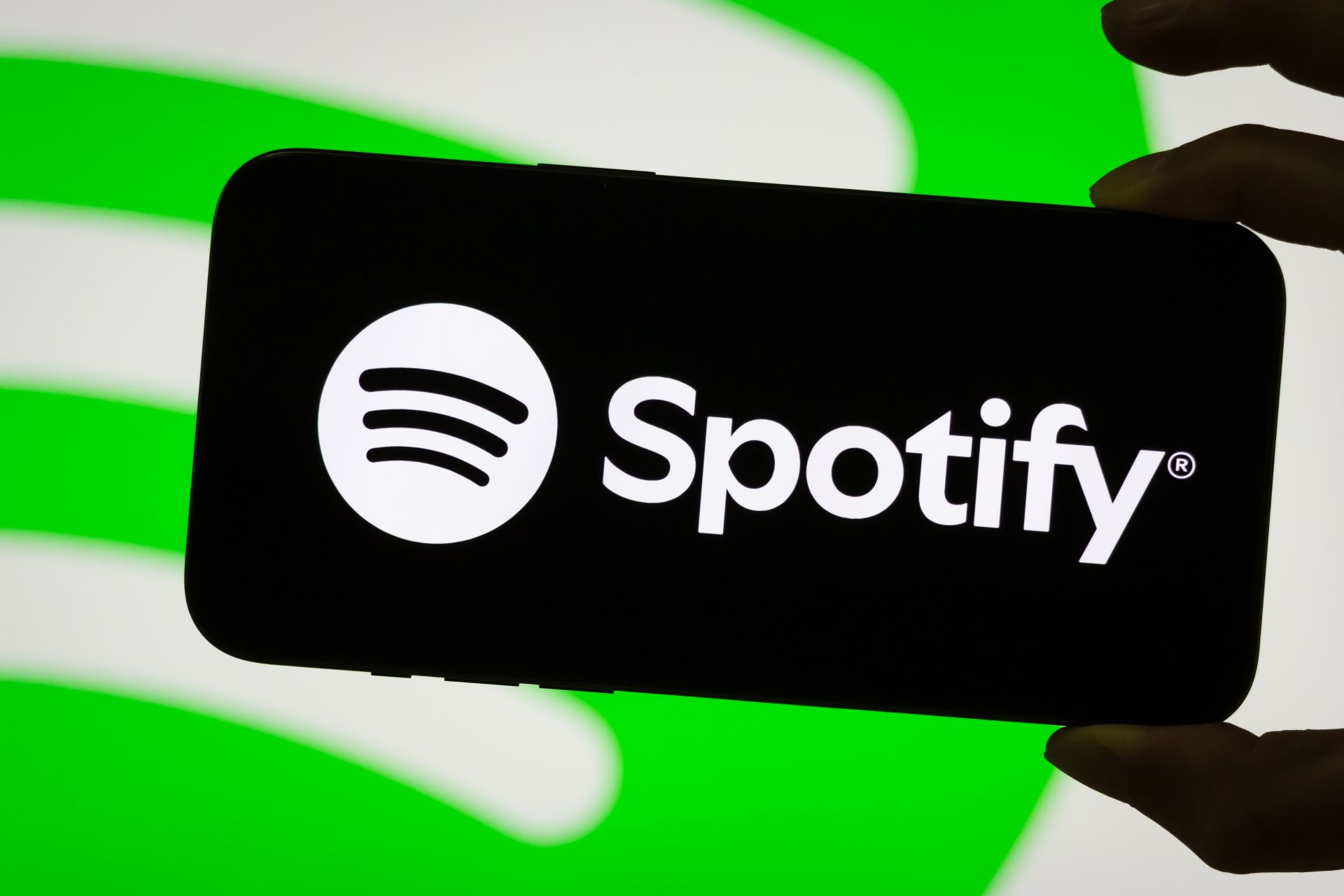 Spotify logo displayed on smartphone screen - Source: Getty