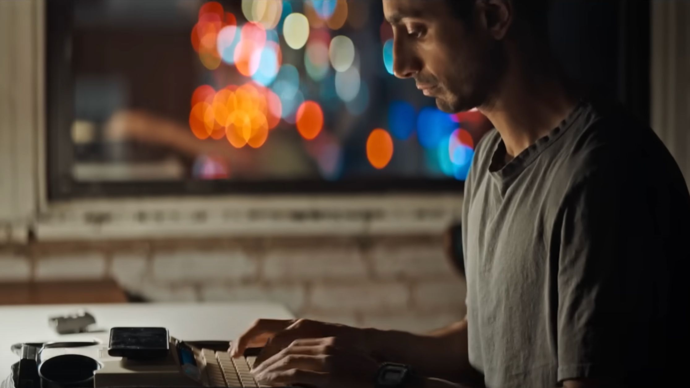 Riz Ahmed stars in Relay, alongside Lily James (Image via YouTube/Bleecker Street)