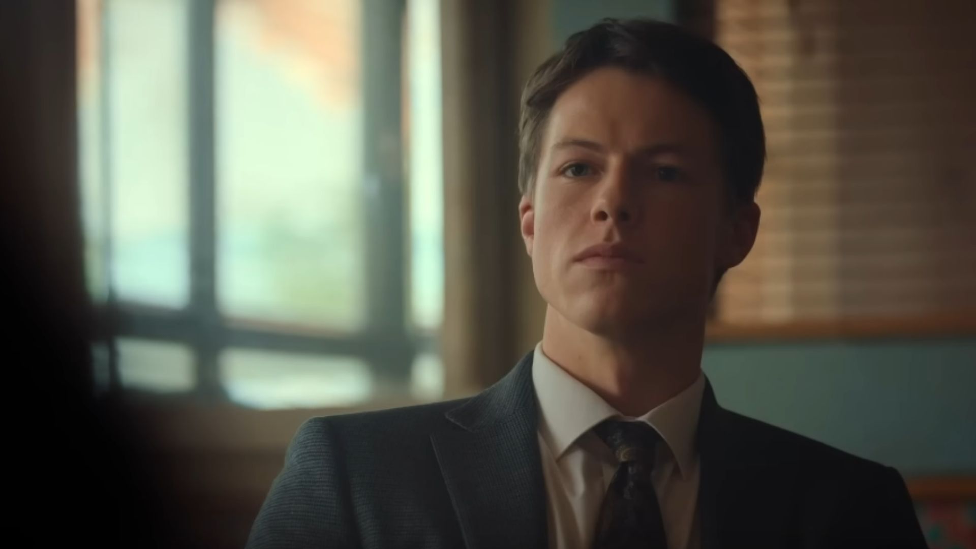Milo Callaghan as Rudy Baylor in The Rainmaker Season 1 Trailer (Image Via:  Rotten Tomatoes TV, YouTube)