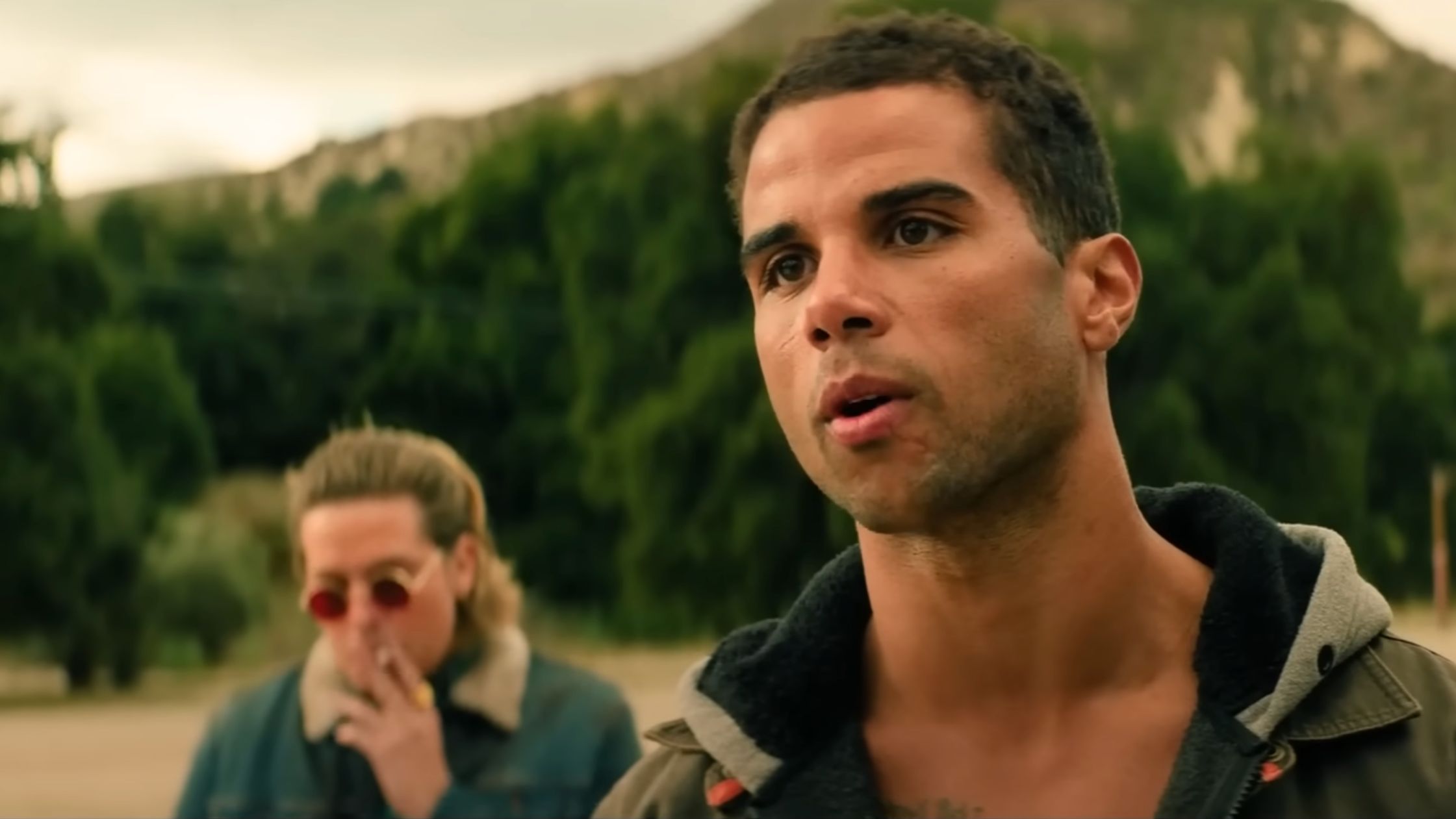 Dylan Sprouse and Mason Gooding in Under Fire (Image via YouTube/ONE Media Coverage)