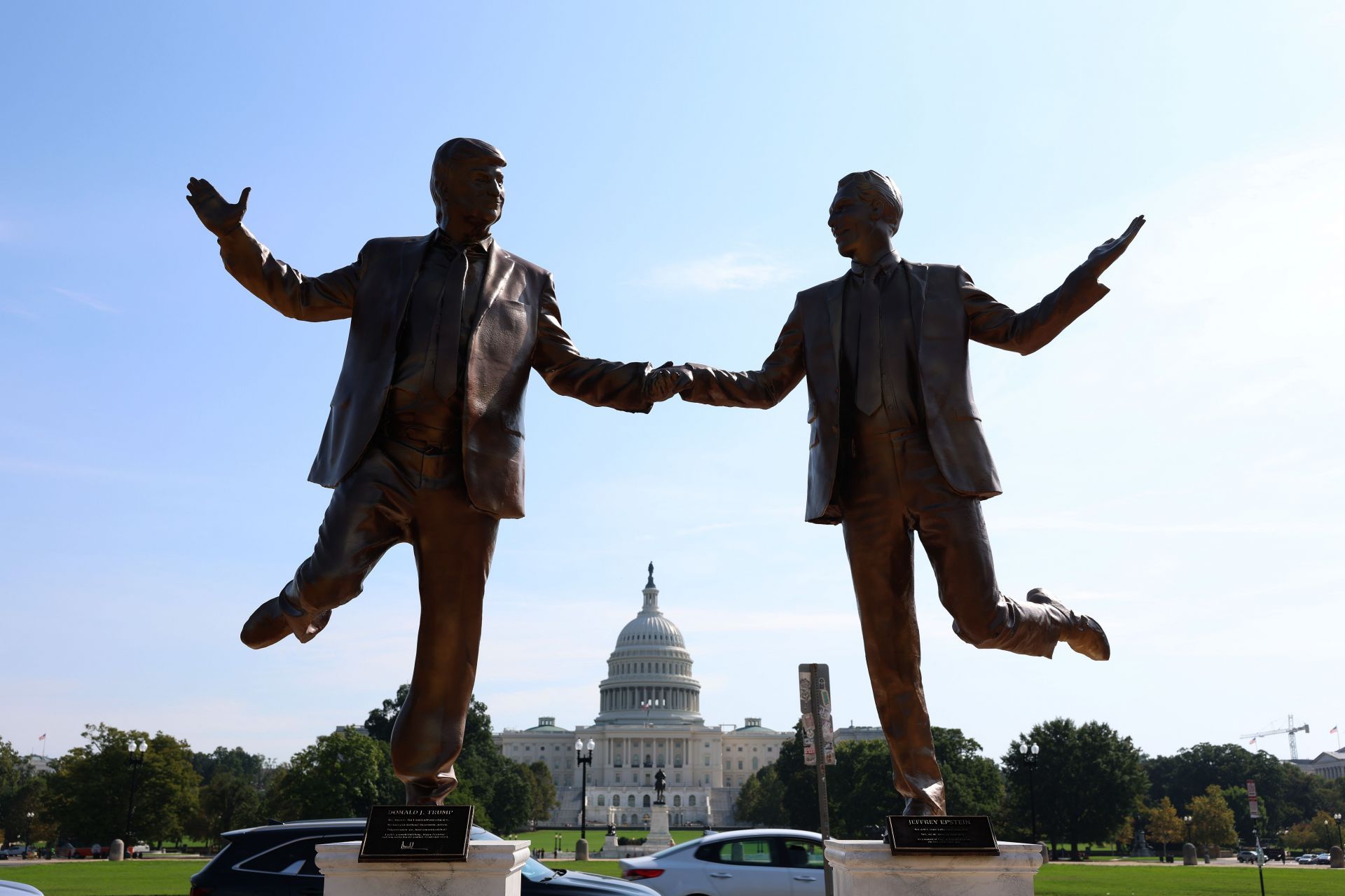 Statue Of Donald Trump And Jeffrey Epstein Holding Hands Appears On National Mall - Source: Getty