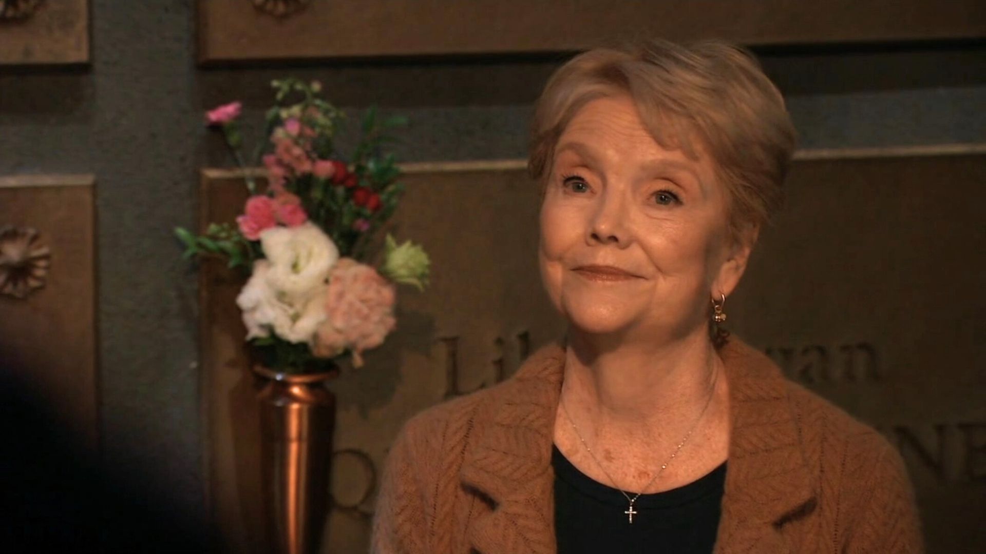 An unknown woman surprises Tracy in the Quartermaine crypt on General Hospital | Image: ABC
