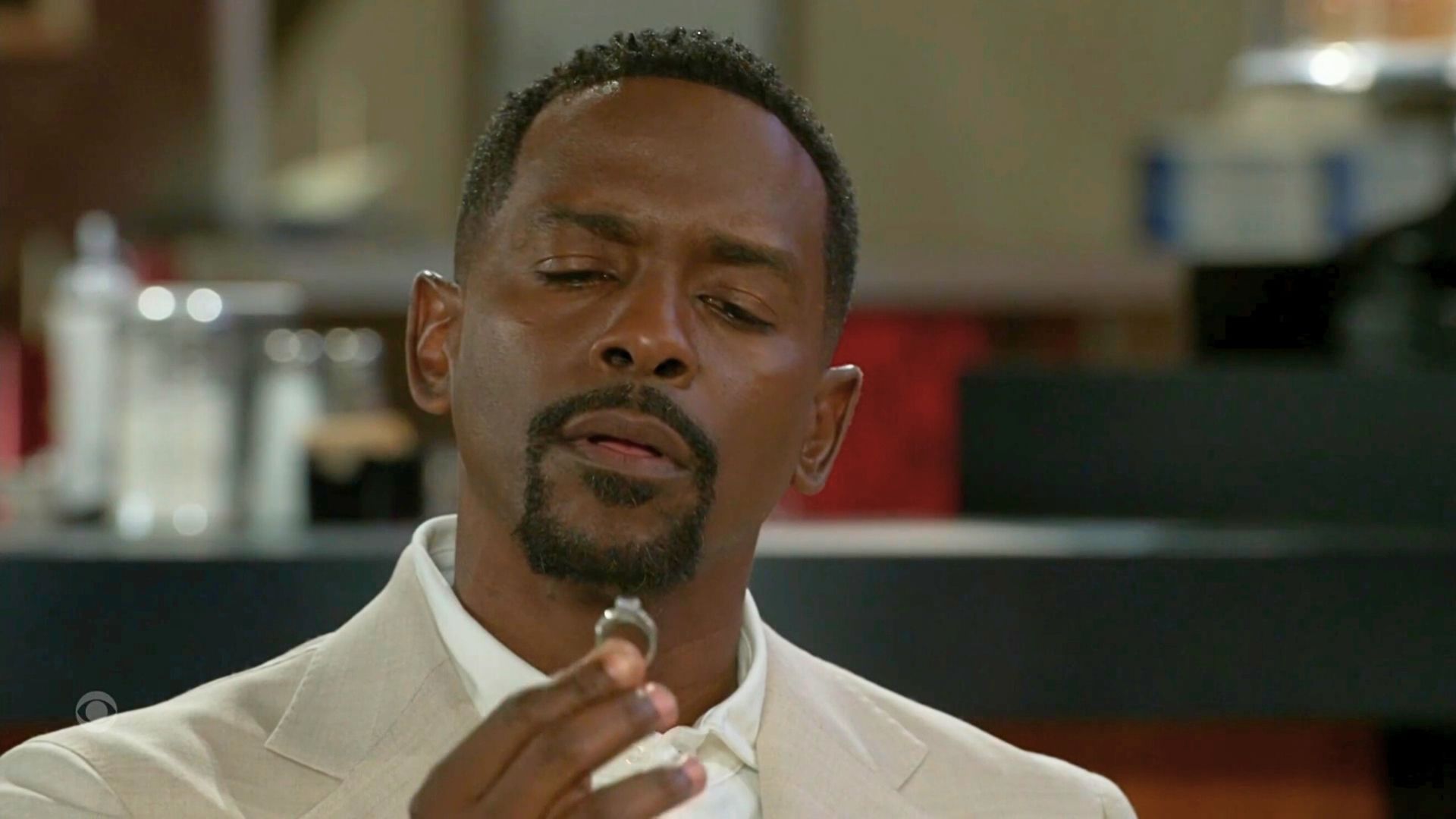 Beyond the Gates: Ted looks at a wedding ring a little different now | Image: CBS