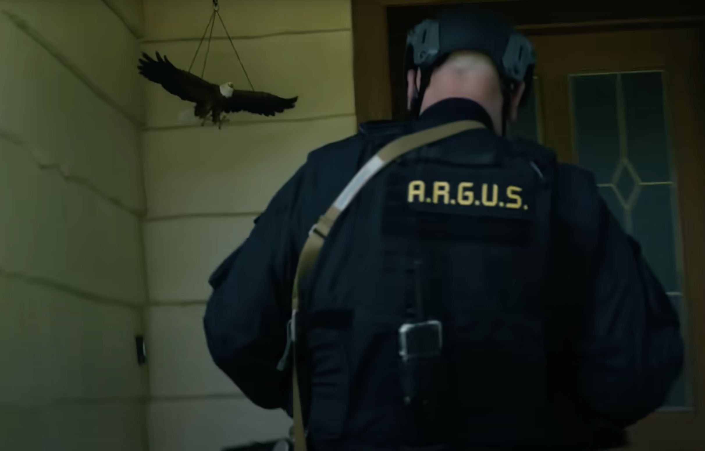 How did Economos save Eagly from getting shot by Red St Wild in Peacemaker Season 2? (Image Via HBO)