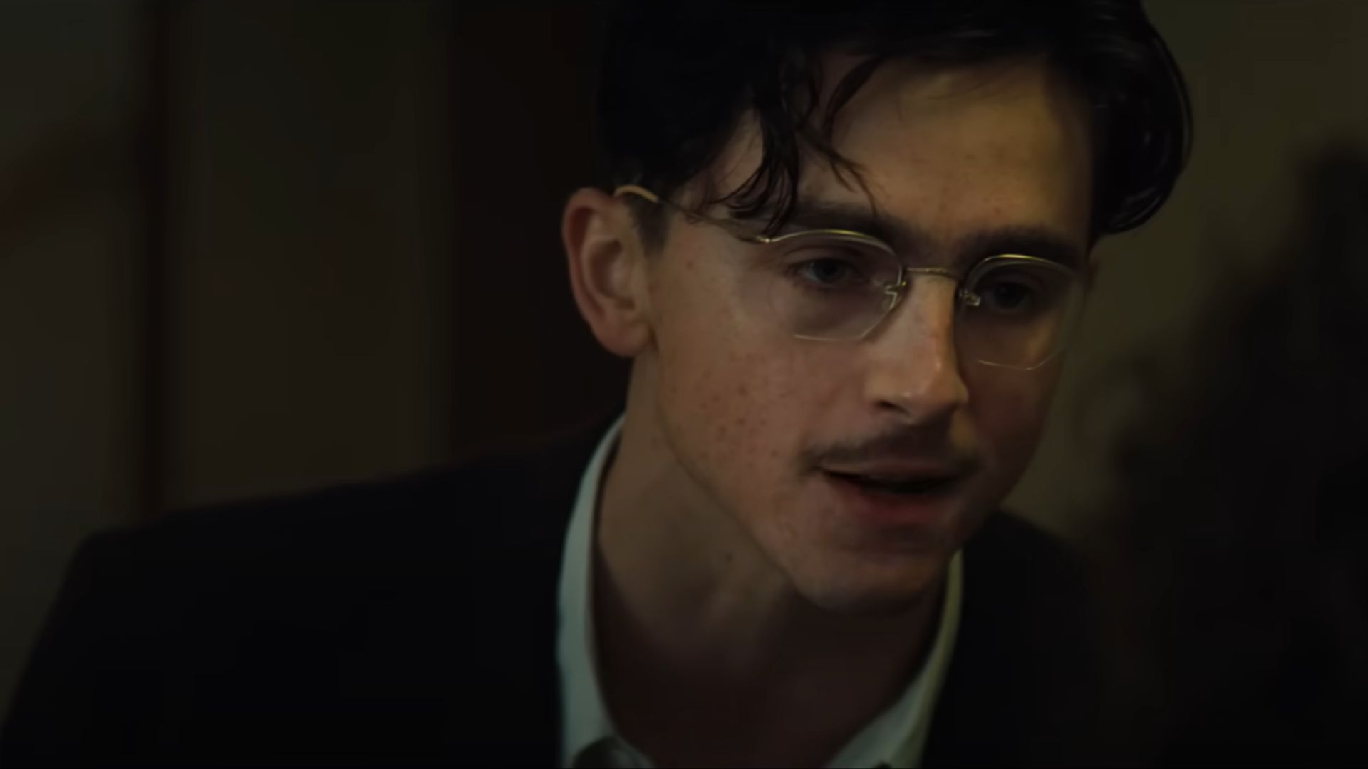 Marty Supreme (Timothee Chalamet) talking to someone while angry