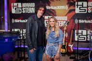 Howard Stern (here with Carrie Underwood) is known for his commentary on contemporary pop culture laced with colorful language (Image via Getty)