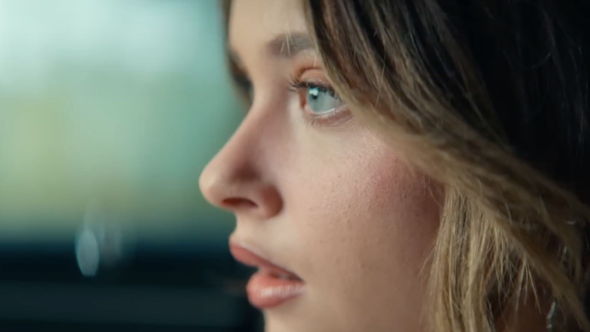 A still from Culpa Nuestra, featuring a close shot of Nicole Wallace