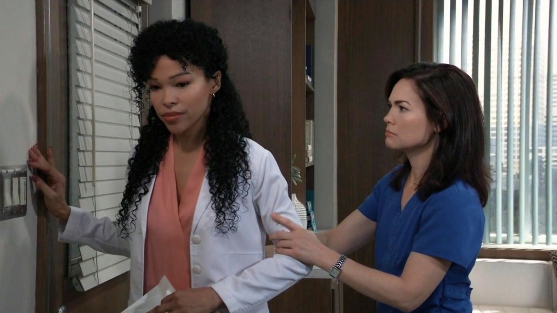 Elizabeth helps Portia after she becomes dizzy and stumbles in her office on General Hospital | Image: ABC