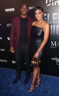 Adrian Peterson with wife Ashley Brown at a promotional event in 2022 (Image via Getty)