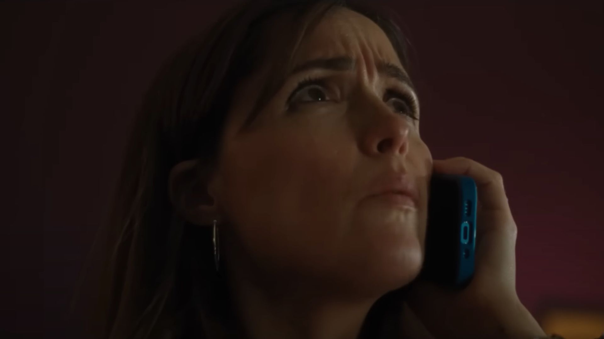 Linda (Rose Byrne) talking over her phone while looking at the ceiling