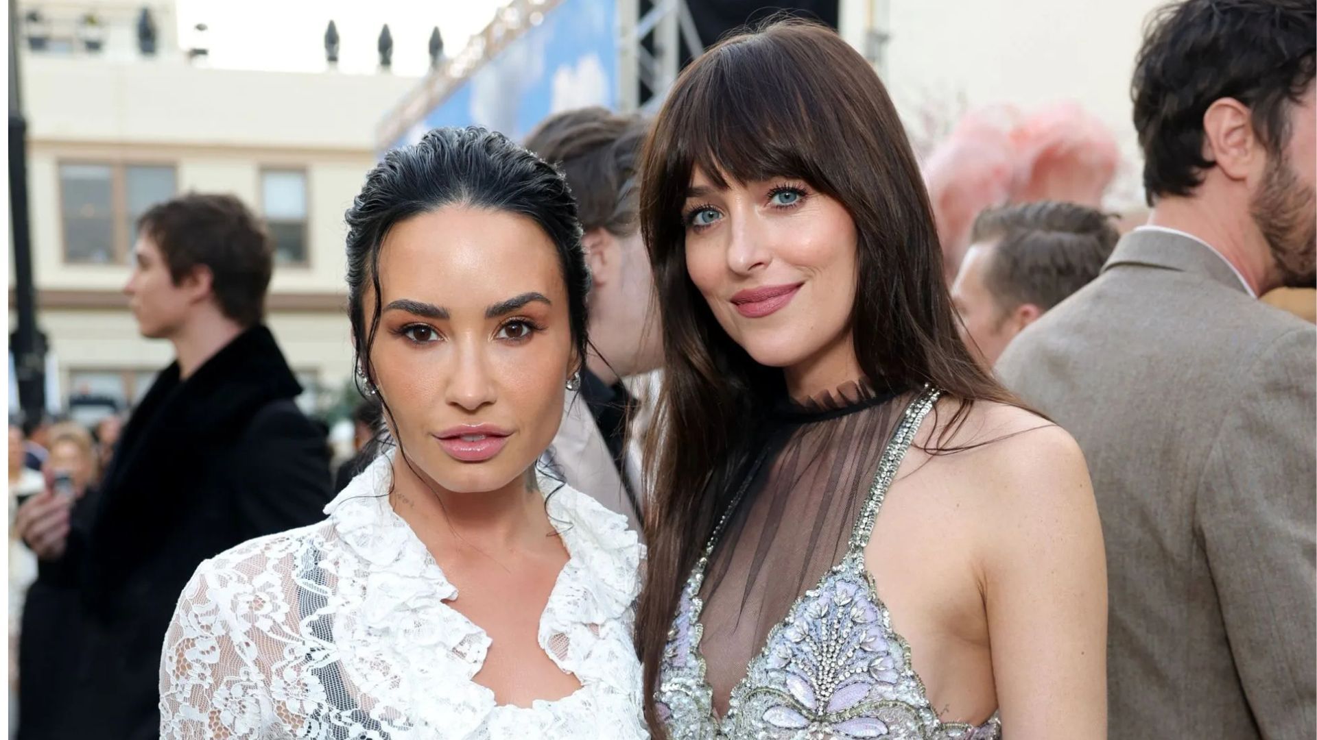 Demi Lovato and Dakota Johnson. (Image via Getty)