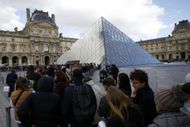 Crowds gather outside the Louvre Museum after Arrests Made In Jewelry Heist Investigation. Image via Getty.