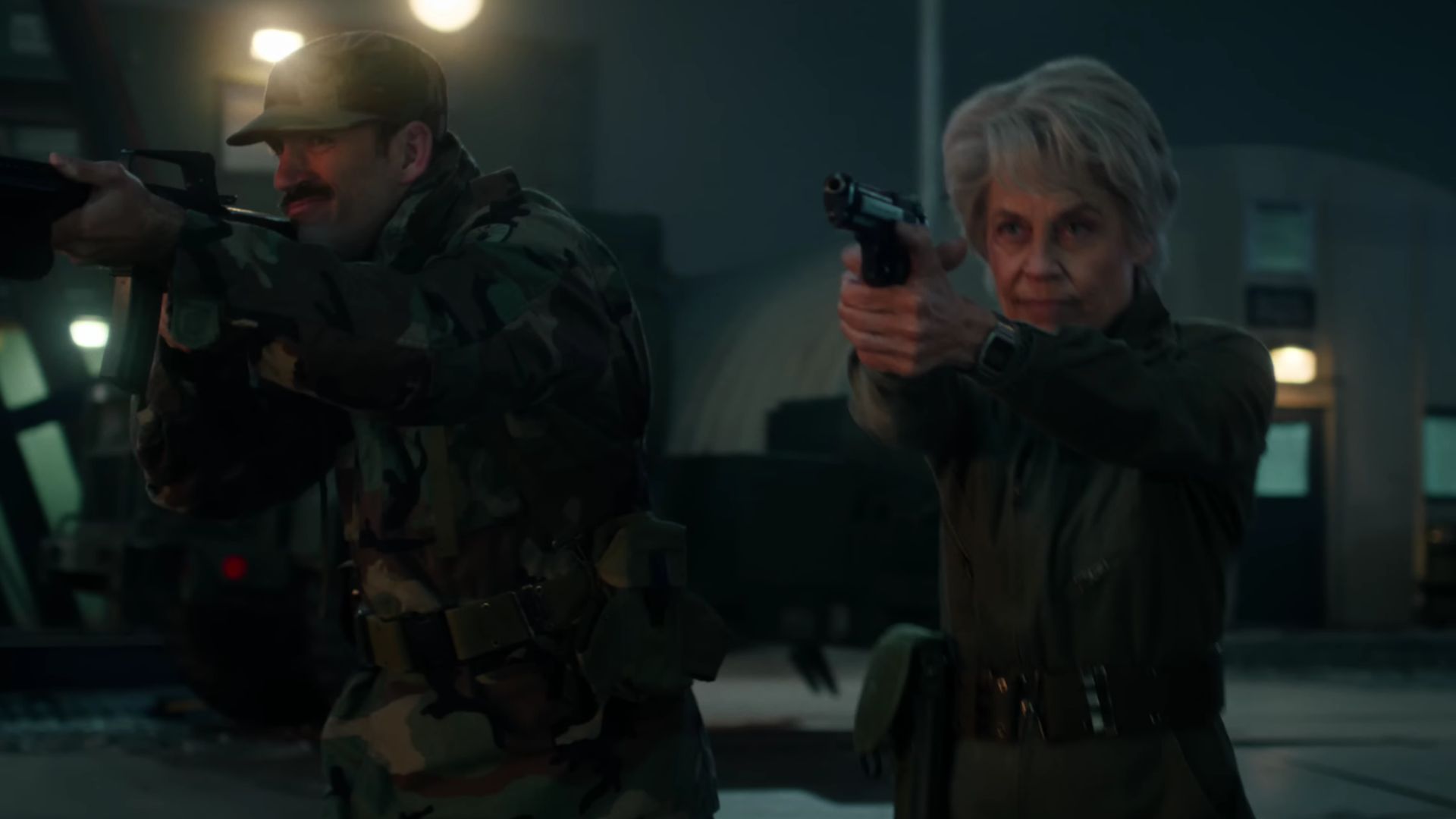 Dr. Kay and another agent shooting (Screenshot from YouTube/@Netflix and Stranger Things)