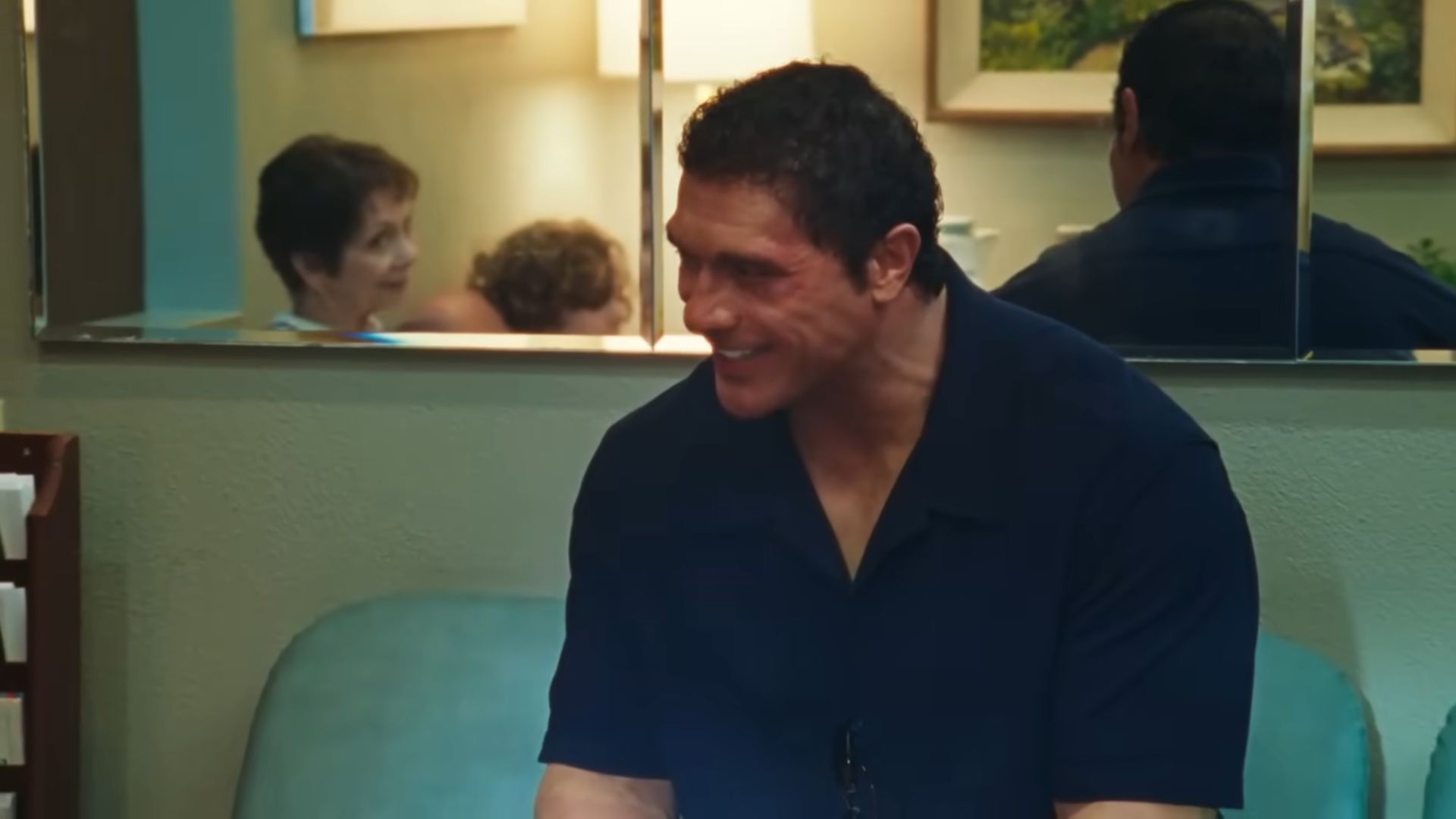 Mark Kerr (Dwayne Johnson) talking and smiling