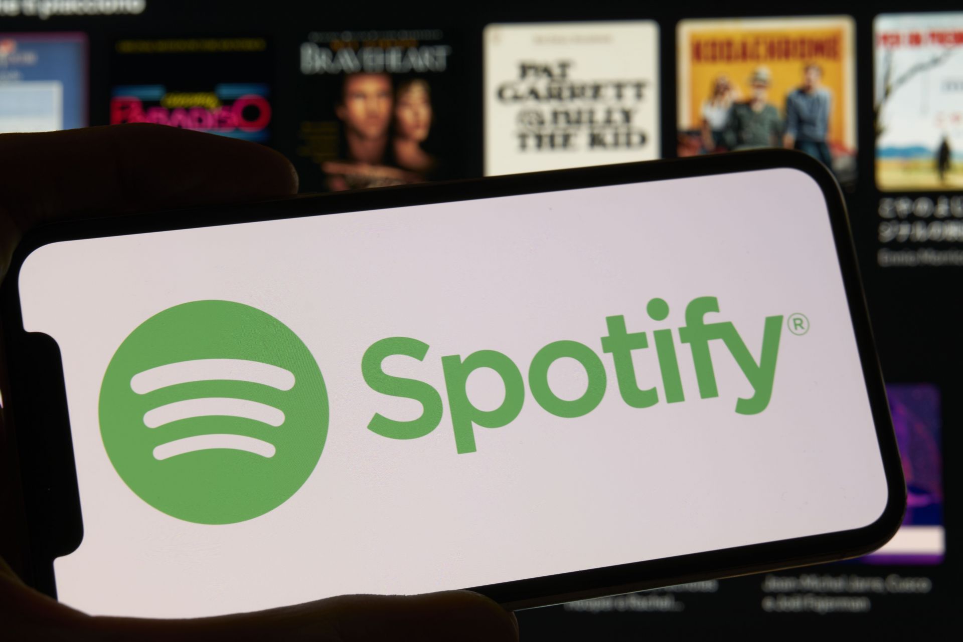 Spotify Logo And App Interface Displayed On Smartphone Screen - Source: Getty