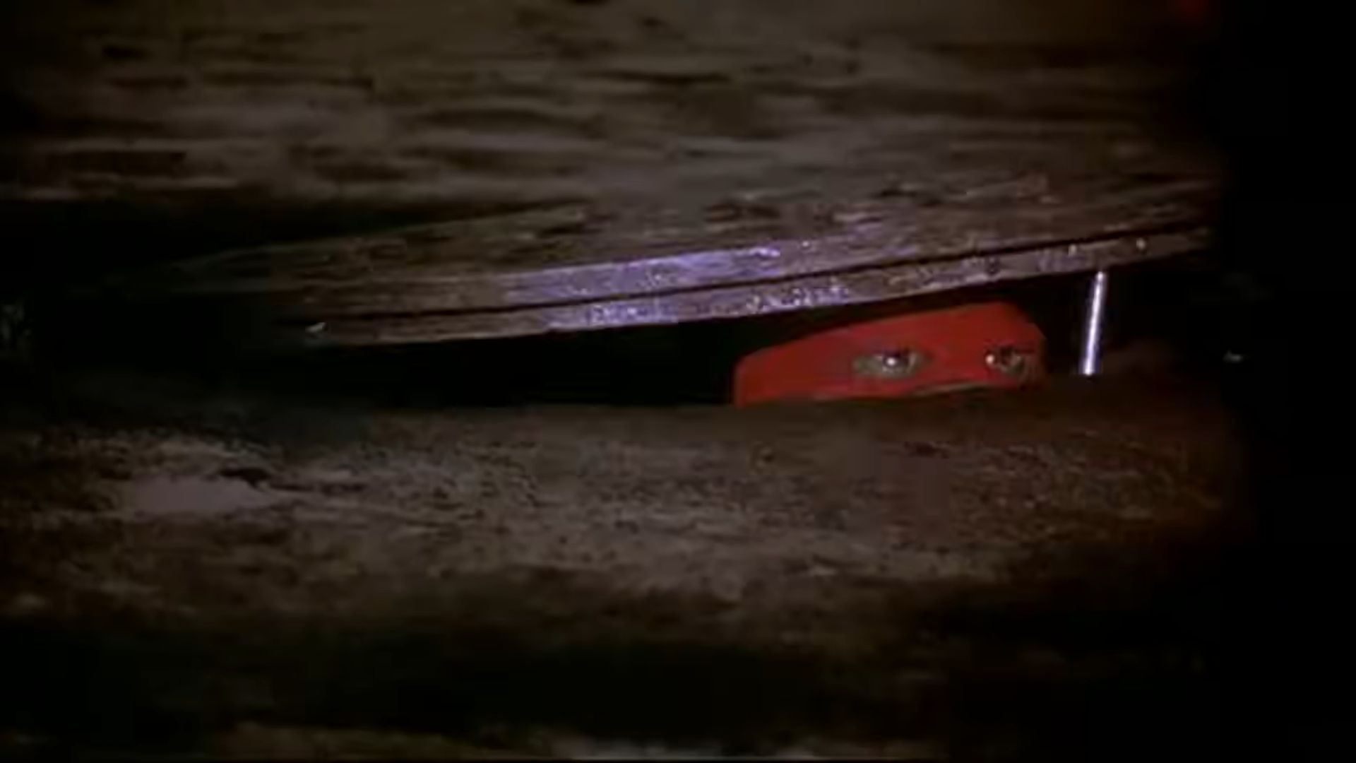 A Ninja Turtle sneaking from the sewers