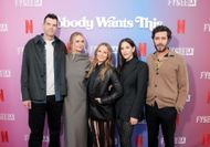 Kristen Bell (center) with her Nobody Wants This costars at a promotional event (Image via Getty)