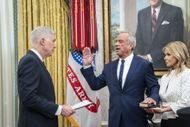 Robert F. Kennedy Jr. is flanked by Cheryl Hines as he is sworn in as the Health and Human Services Secretary, in the Oval Office at the White House in February 2025 (Image via Getty)