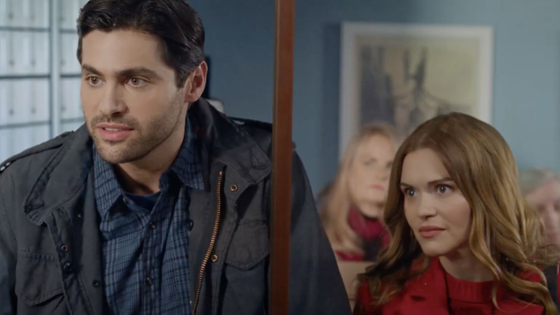A still from Holiday Touchdown: A Bills Love Story, featuring Holland Roden and Matthew Daddario