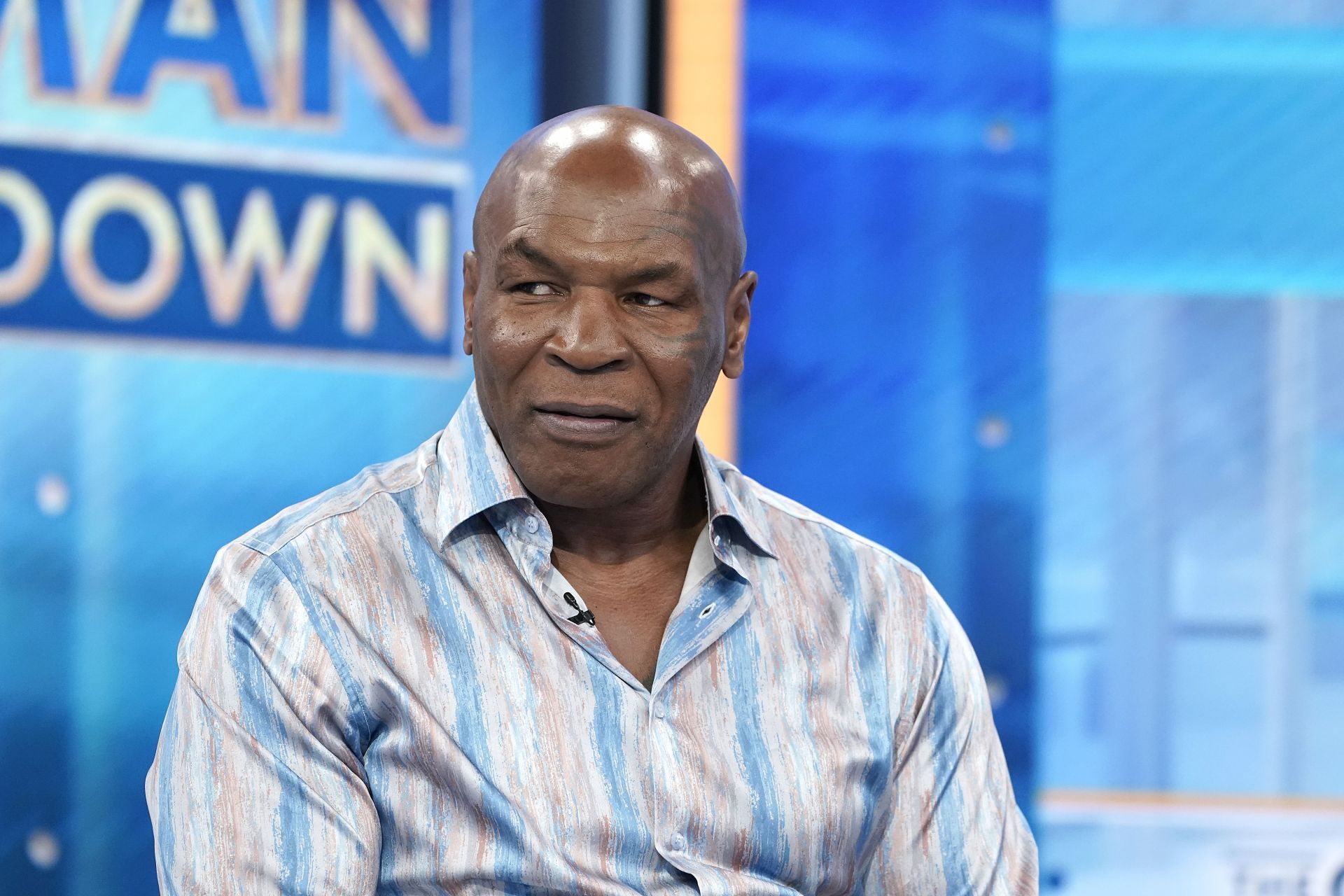Mike Tyson And Chaching CEO Max Sugrue Visits &quot;The Claman Countdown&quot; - Source: Getty