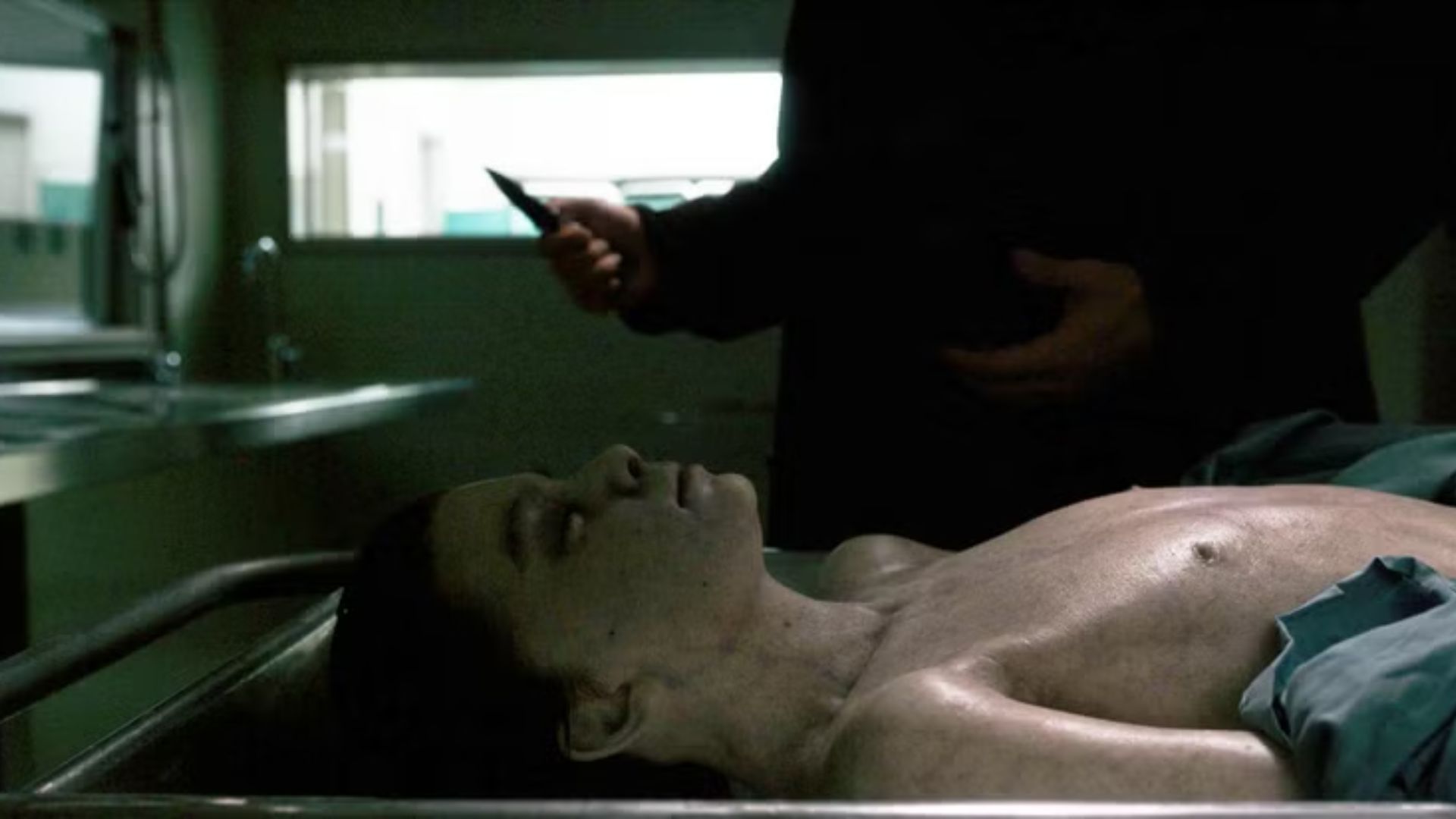 Hopper performing CPR on the lifeless body of Will in Stranger Things | Image via Netflix