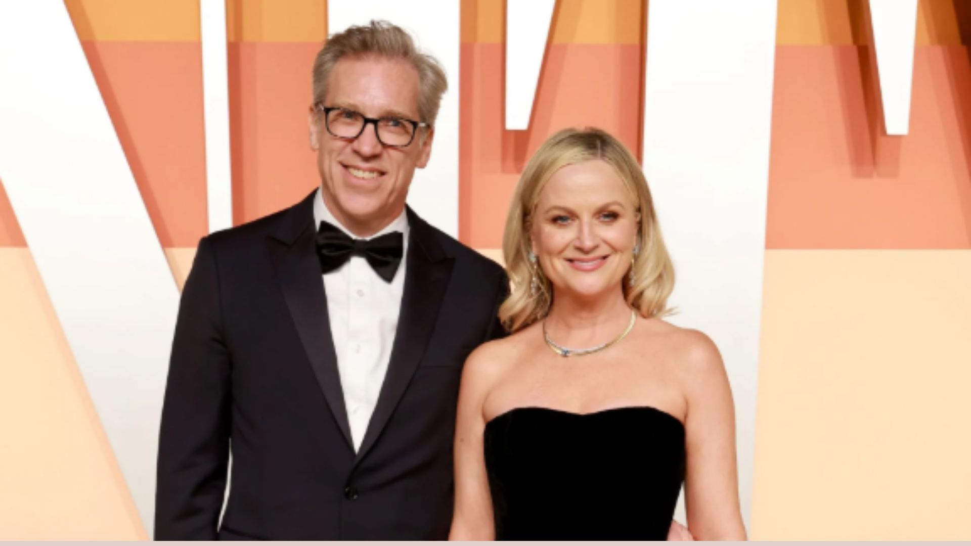 Amy Poehler and Joel Lovell (Image via Getty)