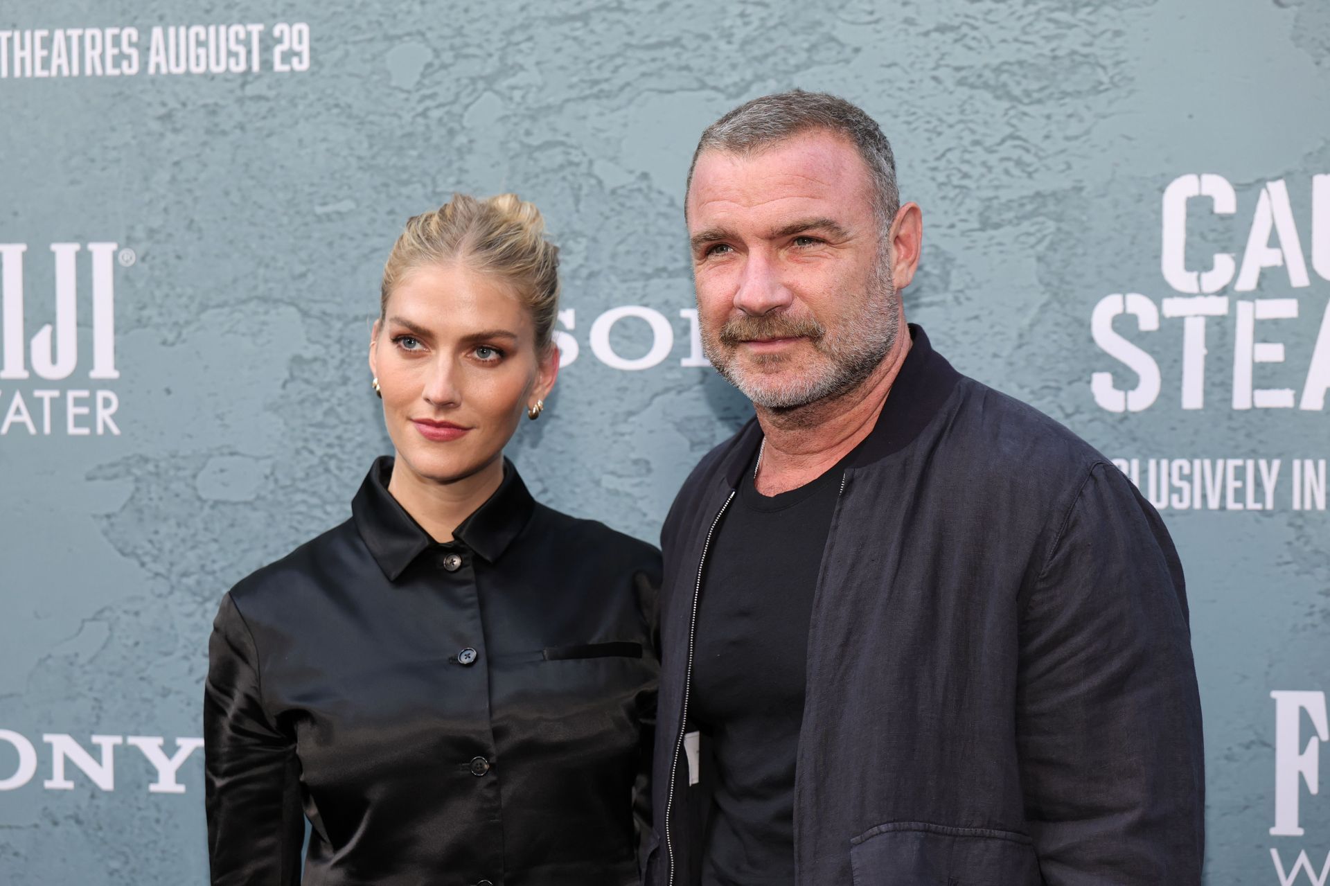 Taylor Neisen and Liev Schreiber at the premiere of &quot;Caught Stealing&quot; in New York (Image via Getty)