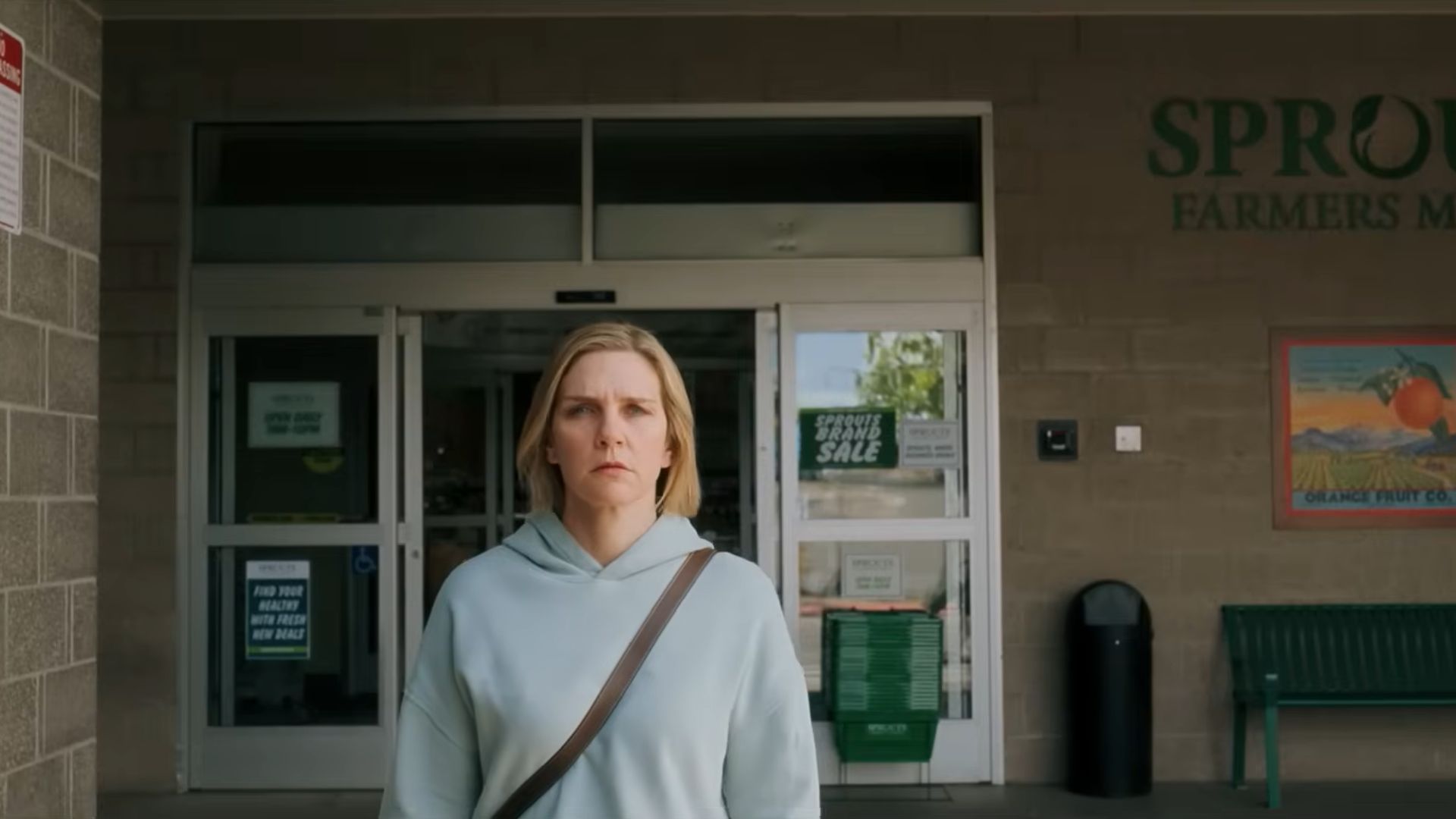 Carol (Rhea Seehorn) walking out of a store