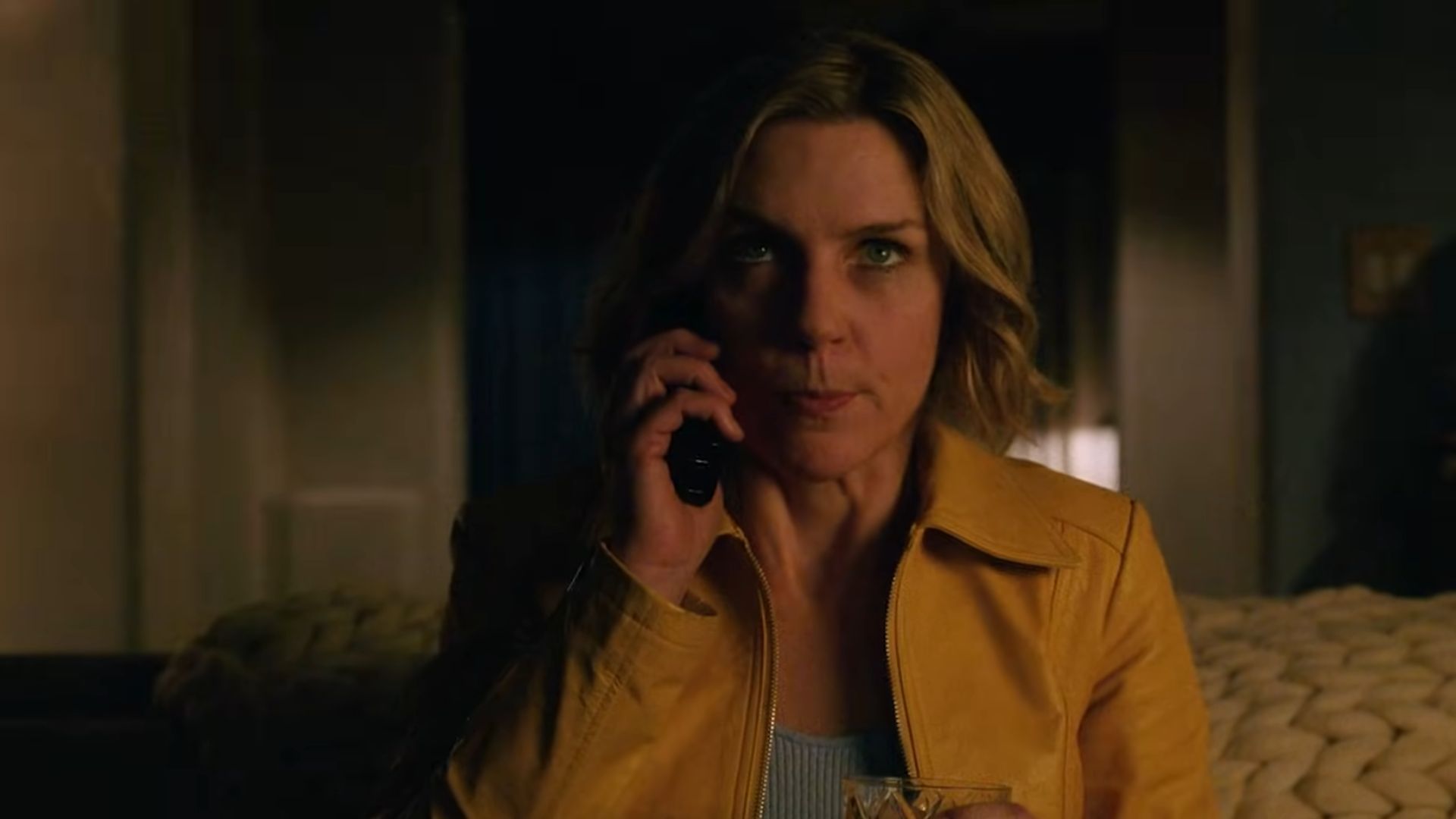 Carol had a phone in her one hand and a beverage in another