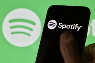 Spotify Logo And App Interface Displayed On Smartphone Screen - Source: Getty