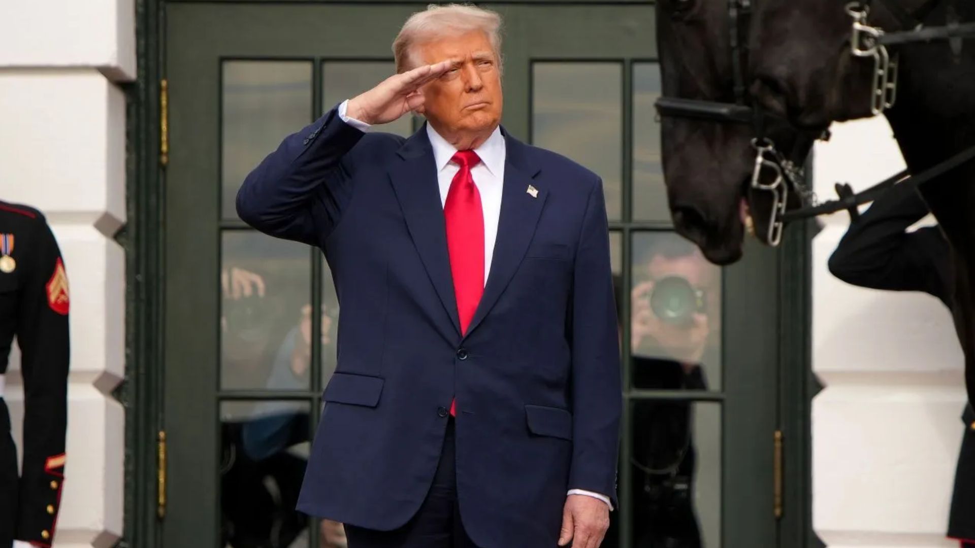 President Donald Trump signs the bill to release Epstein files (Image via Getty)