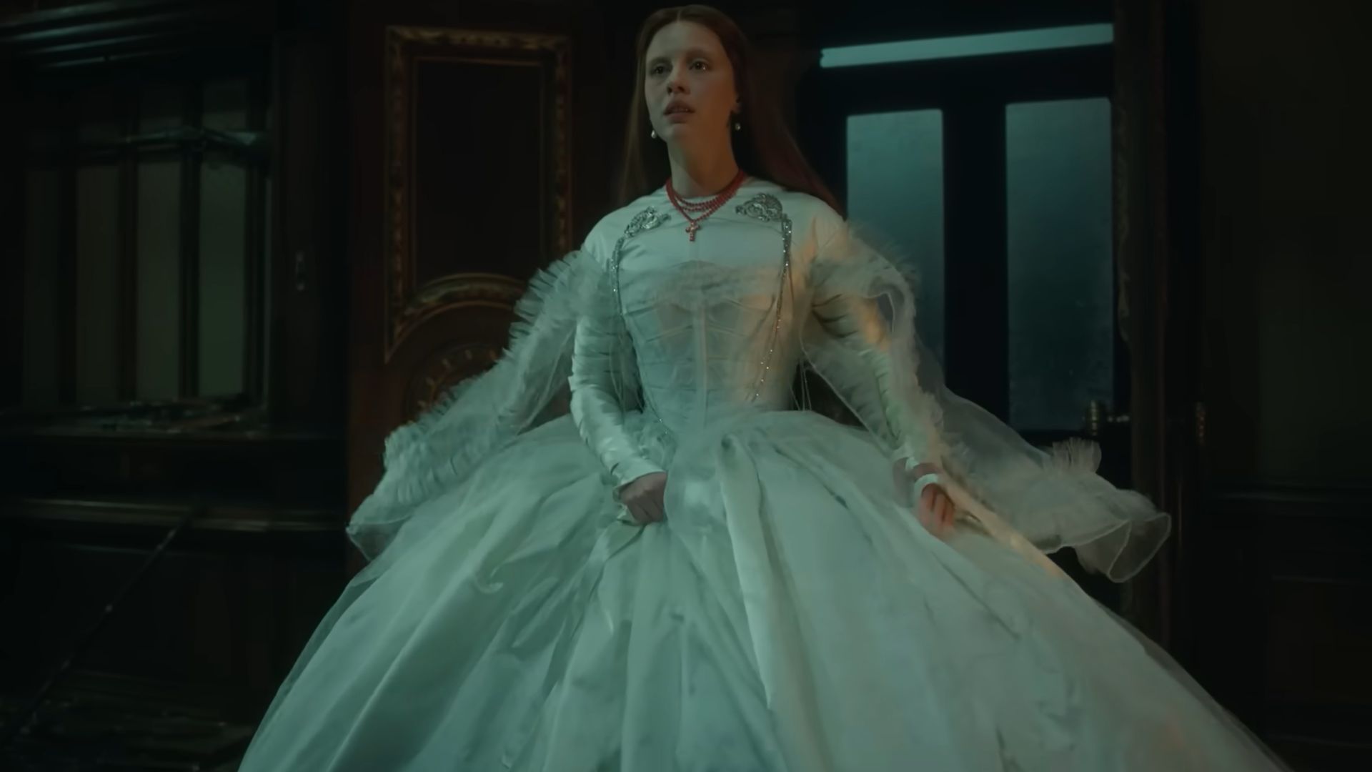 Elizabeth (Mia Goth) in a white dress in Frankenstein